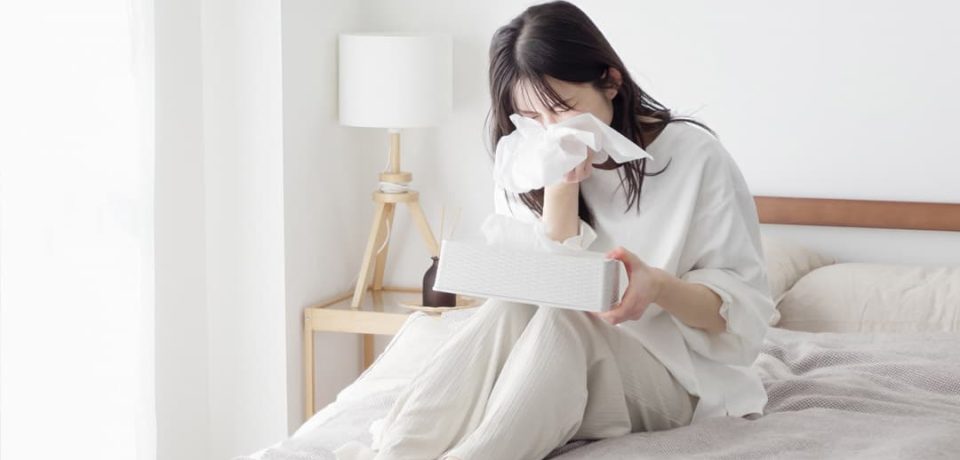 sneezing-and-nasal-irritation-from-allergic-rhinitis Woman experiencing sneezing and nasal irritation from allergic rhinitis